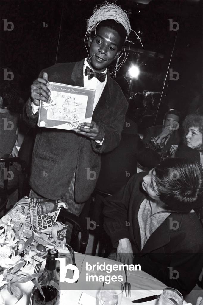 Jean-Michel Basquiat with Etch A Sketch and Bird's Nest, 1985 (b/w photo)