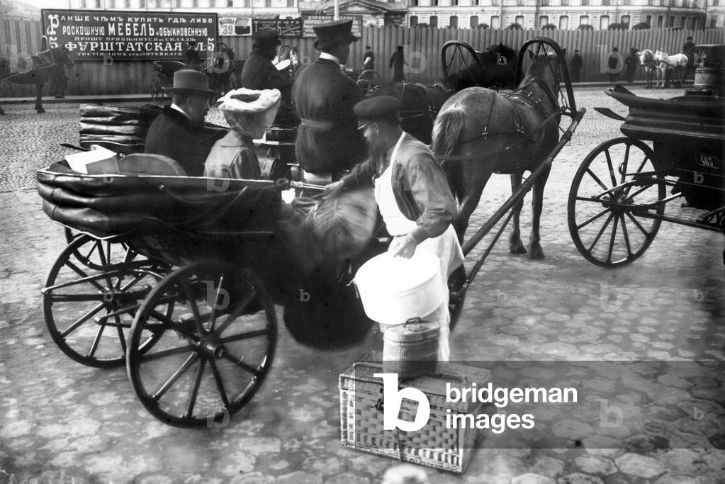 Porter outside the Nicholas Railway Station, St Petersburg, c.1913 (b/w photo)