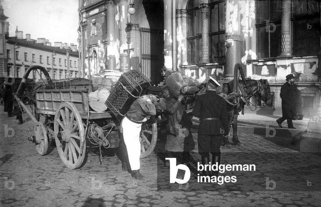 Porter outside Nicholas Railway Station, St Petersburg, c.1913 (b/w photo)