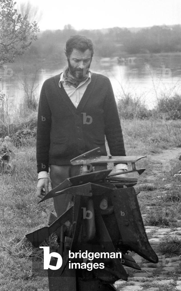 THE PAINTER AND Sculptor JEAN-PIERRE JUFFROY at St Benoist sur Loire with one of his sculptures - April 19, 1975