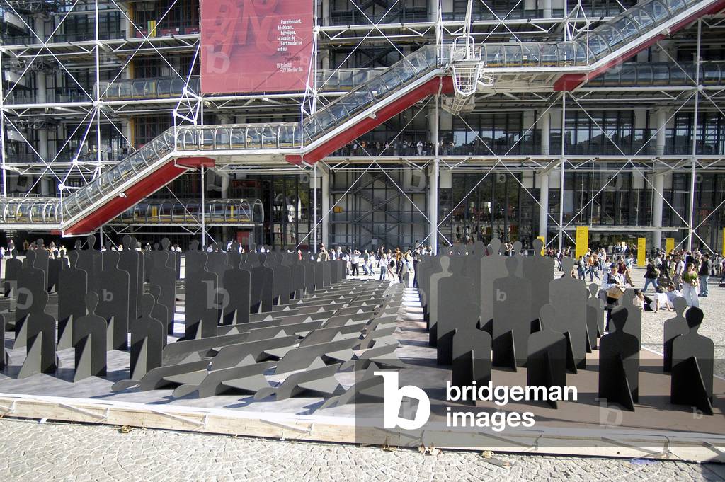1658N- In Beaubourg protest against hunger in the world every 4 seconds a human being dies of hunger with wooden manequins Paris 15 October 2005