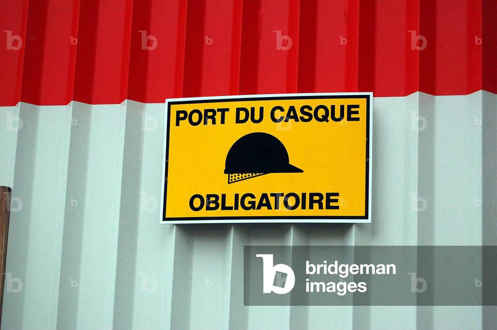 4215N Construction site for the reconstruction of the old Printing Nationale sign indicating that the wearing of helmet is mandatory 27 rue de la Convention in Paris 19 January 2007