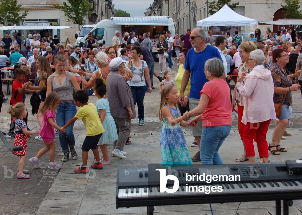 Popular party on the square of the Town Hall of Richelieu