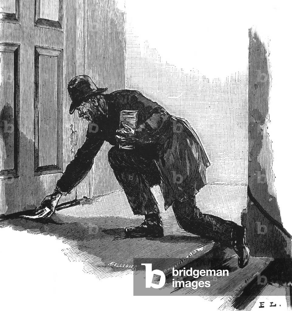 An activist in Germany  sliding leaflets printed in Switzerland for May 1 under a door 1889