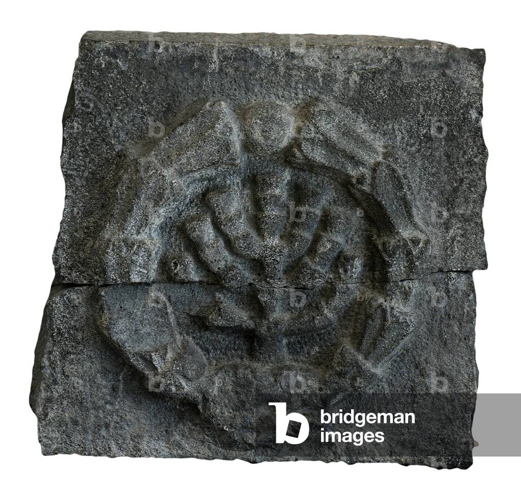 Menorah enclosed within a wreath from a synagogue in Golan, c.3th-5th century AD (basalt stone)