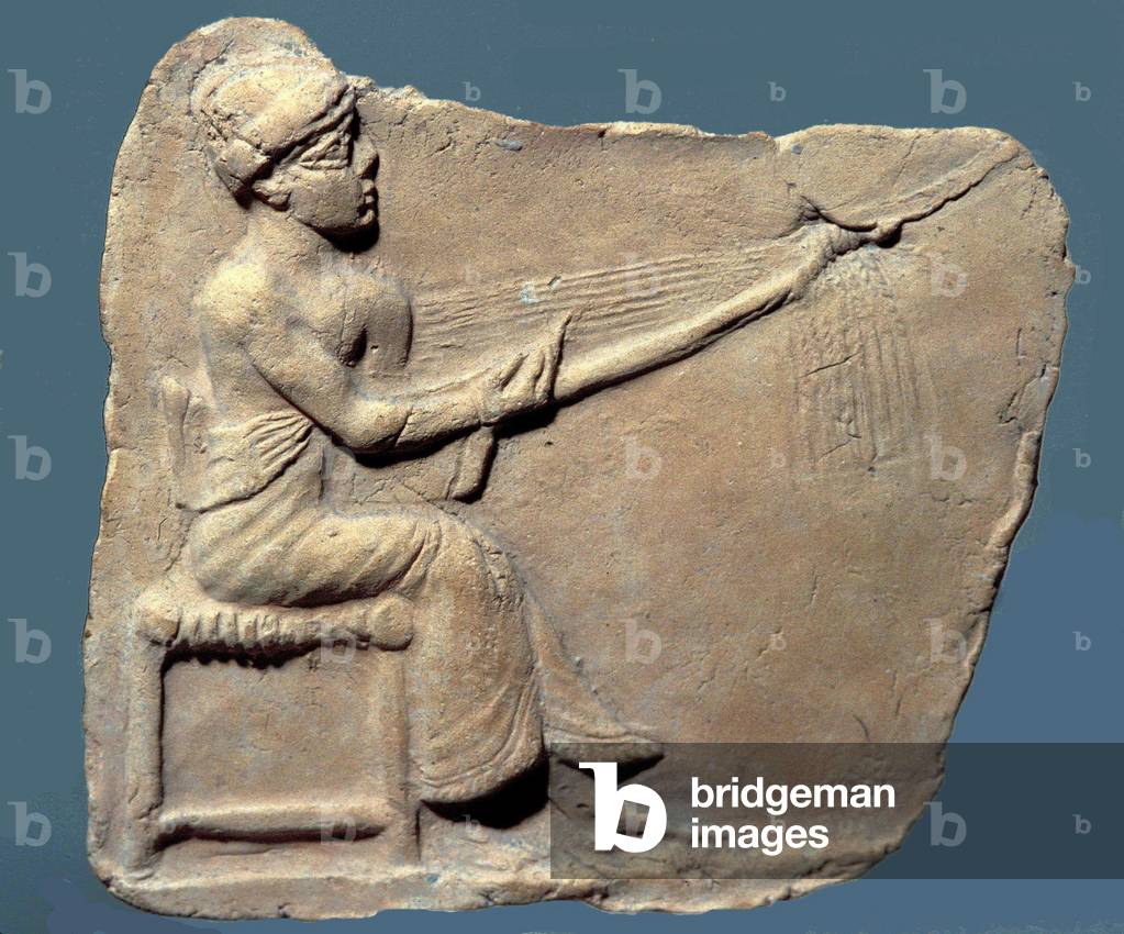 Seated clay figurine of a woman playing a harp,c.2000 BC (terracotta)