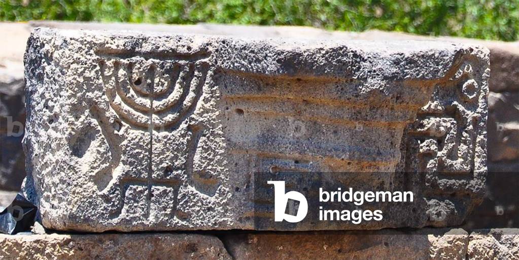 Architectural detail of a candelabra and shofars from the 6th-8th century AD Roman-era Jewish city of Um el Kanatir, Golan, Syria (photo)