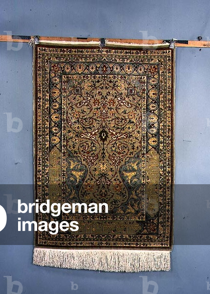 Hereke Silk Prayer Rug, the steel-blue ground richly decorated with palmettes and scrolling floral vines beneath the cusped mihrab, enclosed by ice-blue borders containing calligraphic inscribed cartouches flanked by simple floral guard stripes