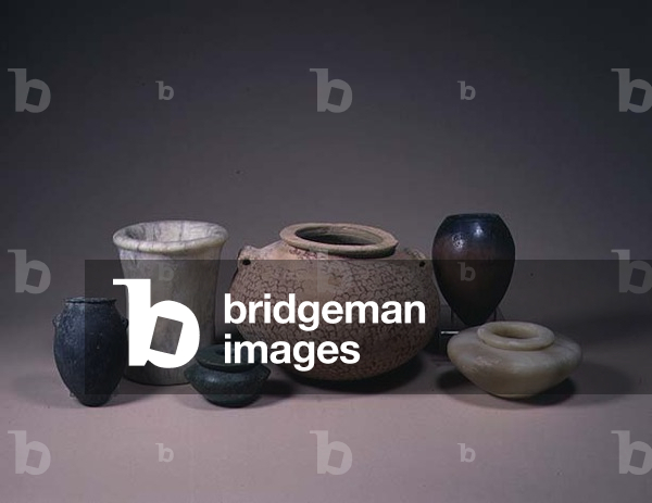 Collection of Egyptian vessels, including an Early Dynastic alabaster jar, Felspar and Naqada II squat jars and a Pre-Dynastic Badarian ovoid jar, ranging from 4500-2494 BC