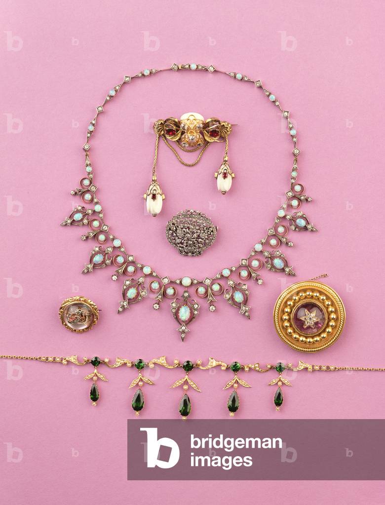 Selection of Victorian jewellery: tourmaline and split pearl fringe necklace; rose-cut diamond oval brooch; opal and diamond necklace; cabuchon amethyst star brooch; Essex crystal of snarling tiger