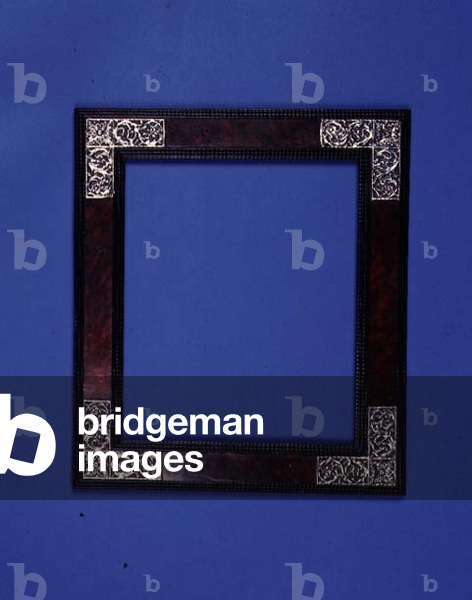 Dutch 17th century carved ebony and tortoiseshell cabinet frame, the veneered frieze with foliate embossed silver mounts to the corners, ripple carved edges and ebony veneered backframe