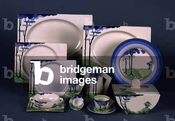 (LtoR) A 'Blue Firs' pattern Biarritz part dinner service, soup bowl and stand, tureen and conical coffee set, by Clarice Cliff (1899-1972) (ceramic)