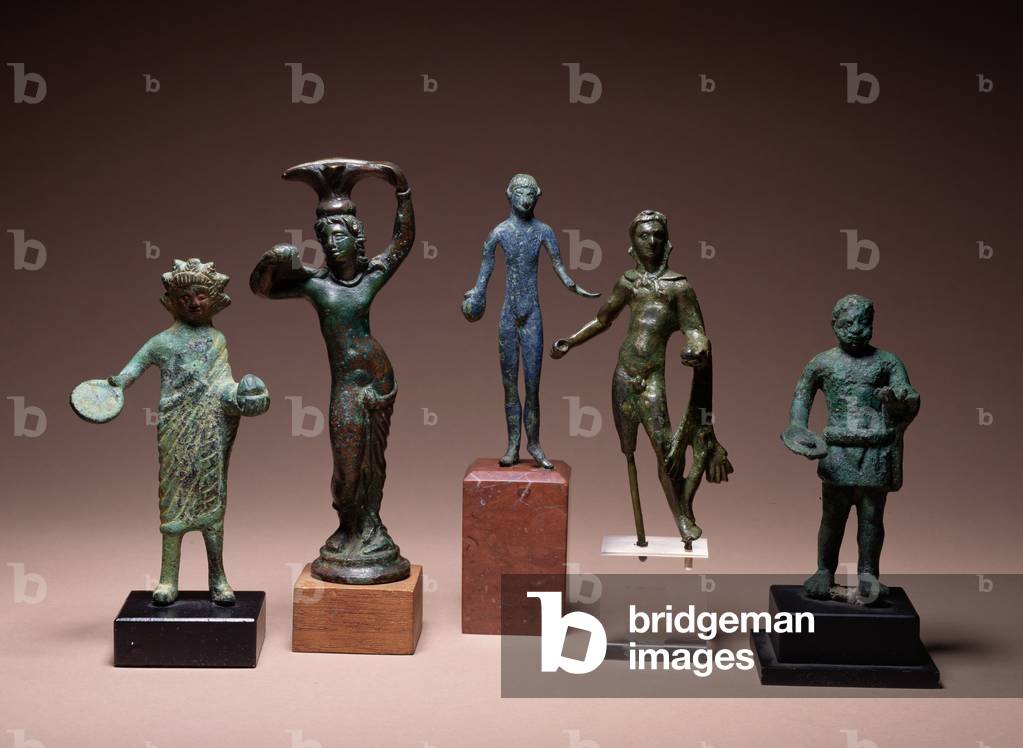 Collection of Etruscan antiquities including a figure of Hercules and a patera handle in the form of a semi-draped male figure, ranging from the 5th to the 3rd century BC (bronze)