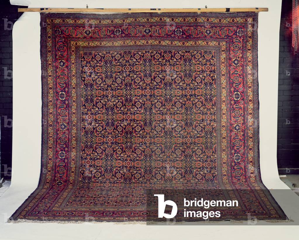 Tabriz Carpet, the indigo field of all over herati design enclosed by madder 'samovar' and leaf borders between multiple guard stripes