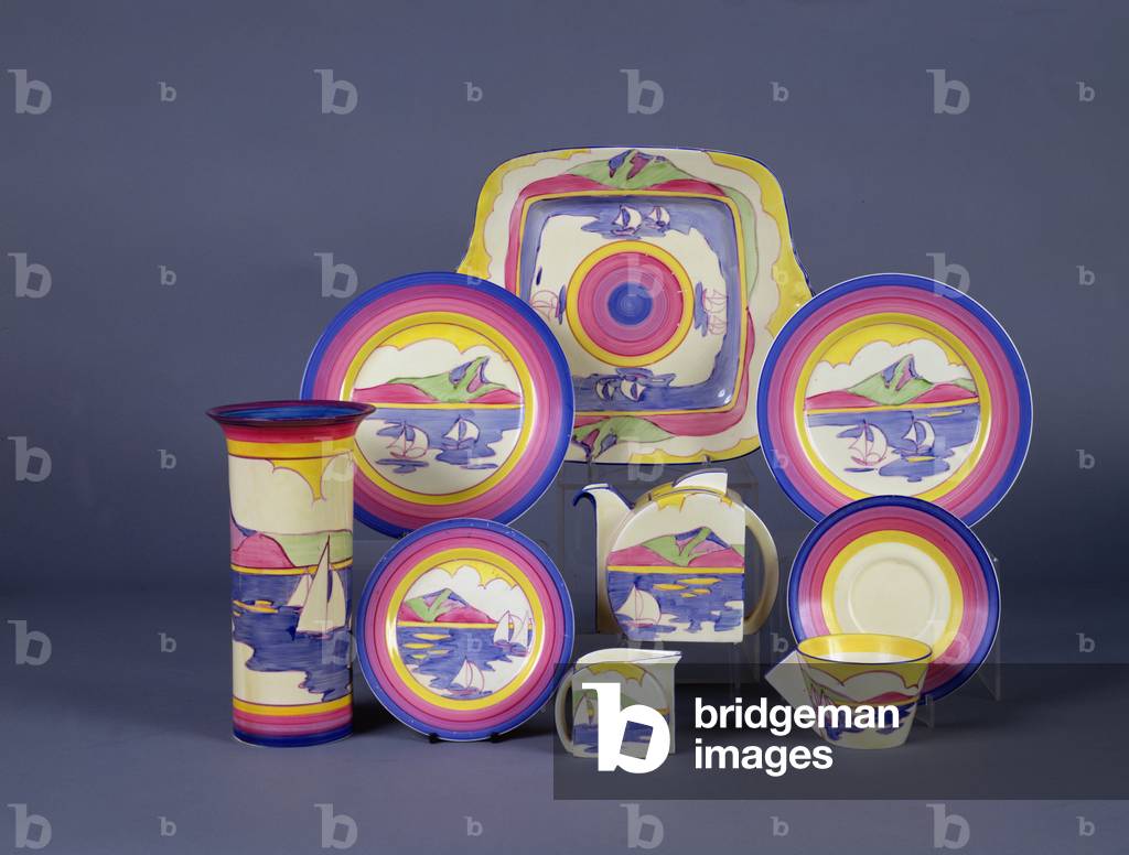 A 'Gibraltar' pattern service, including plates, a Stamford teapot, a milk jug a sandwich plate and a conical cup and saucer, by Clarice Cliff (1899-1972)