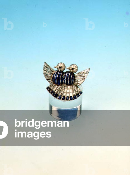 Calibre cut sapphire and diamond double bird brooch by Mauboussin, Paris 1920