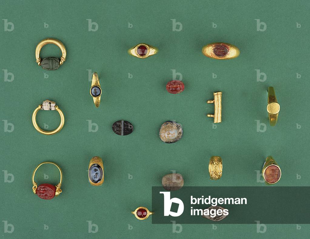 Collection of Roman, Etruscan and Hellenistic Jewellery including a Phoenician scarab ring, a cameo, amulet holders and an agate intaglio, ranging from the 6th century BC to the 4th AD
