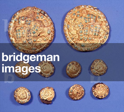 Several plaques, the two larger each depicting a bearded horseman, the eight smaller decorated with horse's heads, all studded with turquoise gems, Bactrian, c.4th-3rd century BC (sheet gold over an iron core, with gems)
