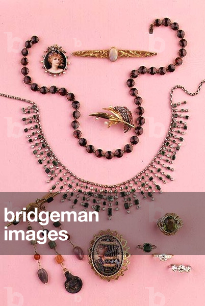 Selection of jewellery: garnet collet necklace; emerald and diamond fringe necklace; oval enamel brooch with pharaoh; pendant brooch with semi-precious gems; peridot and diamond dress ring; ruby and pearl brooch; Art Nouveau opal bar brooch; Art Nouveau enamel pendant