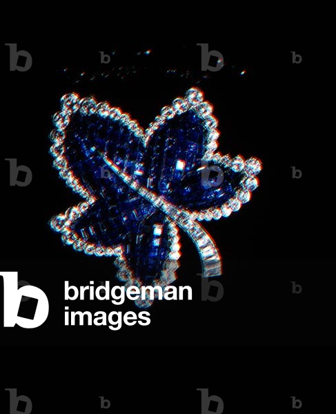 Invisibly set sapphire and diamond clip brooch in the form of a maple leaf by Van Cleef and Arpels