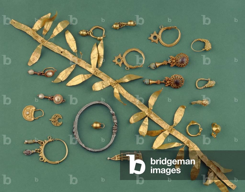 A collection of Hellenistic, Byzantine, and Roman jewellery including a gold leaf diadem, an Eastern Mediterranean silver bracelet, crescentic pendants and a gold fibula, ranging from the 3rd to the 1st century AD (gold, silver)