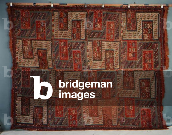 Caucasian Sileh, the polychrome field with four columns of polychrome dragons surrounded by geometric devices enclosed by narrow skittle borders flanked by barber poles