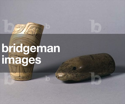 LtoR: container from the North American Indian Haida tribe (ivory); Eskimo handle in the form of a seal's head, used for testing ice (ivory)