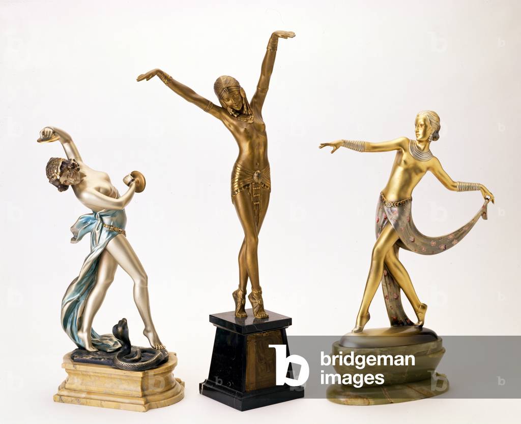 Set of three gilt bronze and ivory sculptures