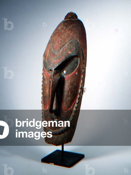 Oval-shaped face mask with a looped nose from the Manam Islands, New Guinea (polychrome wood)