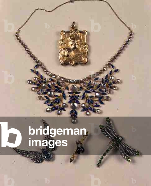 Fine Jewellery, clockwise from top: Art Nouveau gold locket by Jean-Baptiste Emile Dropsy (1858-1923); a moonstone, gold and enamel suite of mistletoe design, c.1890; an Edwardian aquamarine and diamond brooch; a Victorian gem set bar brooch with a ruby bug, c.1870; a late 19th century demantoid garnet and diamond dragonfly brooch