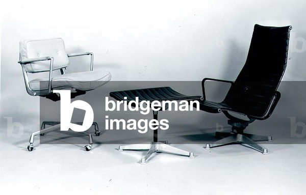 (LtoR) 'Intermediate' Desk Chair, 1968 and 'Naugahyde' Aluminium Group Lounge Chair and matching Footstool, 1958, designed for Herman Miller by Charles Eames (1907-78) (aluminium) (b/w photo)