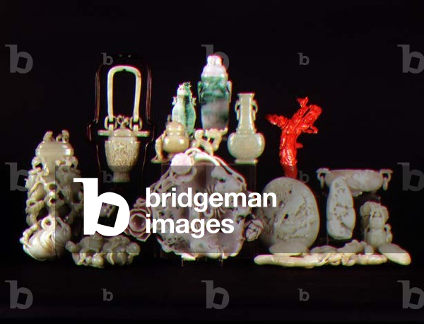A collection of elaborately carved jade objects including vases, brush washers and a coral carving of a female immortal, Chinese, Qianlong Dynasty (1736-95) Qing Dynasty (1700-1800) and some 19th century