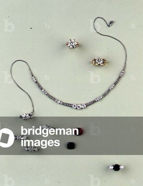Selection of diamond jewellery: cushion shaped diamond necklace; brilliant cut diamond rings; cushion shaped ruby; step cut emerald