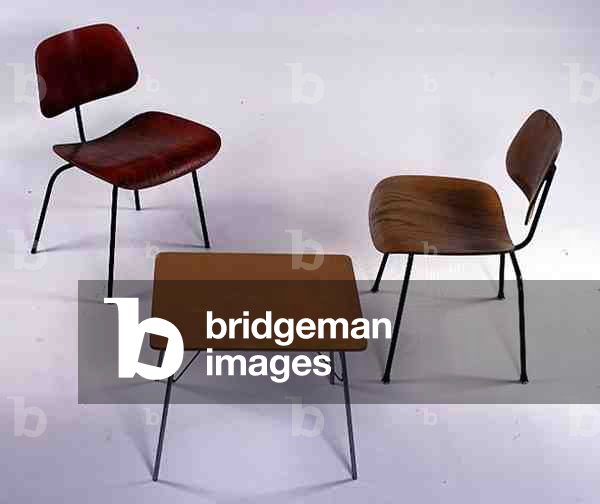 An LCM (Lounge Chair Metal), a Children's/Occasional Folding Table and a Calico Ash DCM (Dining Chair Metal), all designed by Eames, Charles (1907-70) and Ray (1912-1988), 1947 (plywood)