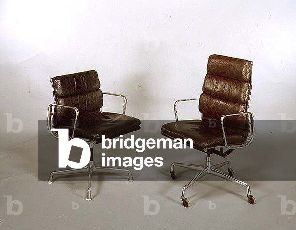 (LtoR) Soft Pad Arm Side Chair and high back Desk Chair, designed by Charles Eames (1907-78) 1969 (leather and tubular steel)