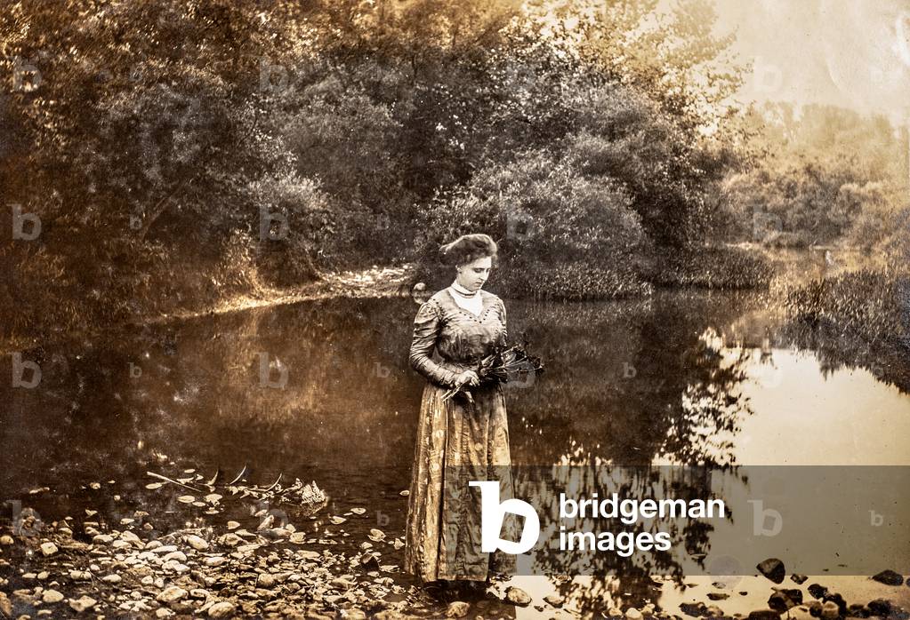 Portrait of woman on the edge of a pond, c.1915 (silver gelatin print)