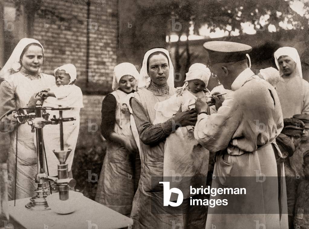German Doctor Vaccinating Children and Babies, Vilna, Lithuania, c.1916 (silver gelatin print)