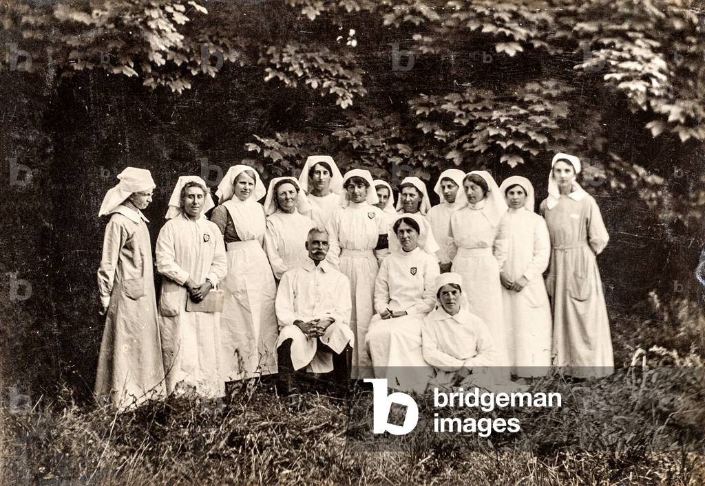 Group Portrait of Nurses with Doctors Outdoors, c.late 1800s/early 1900s (cabinet card)