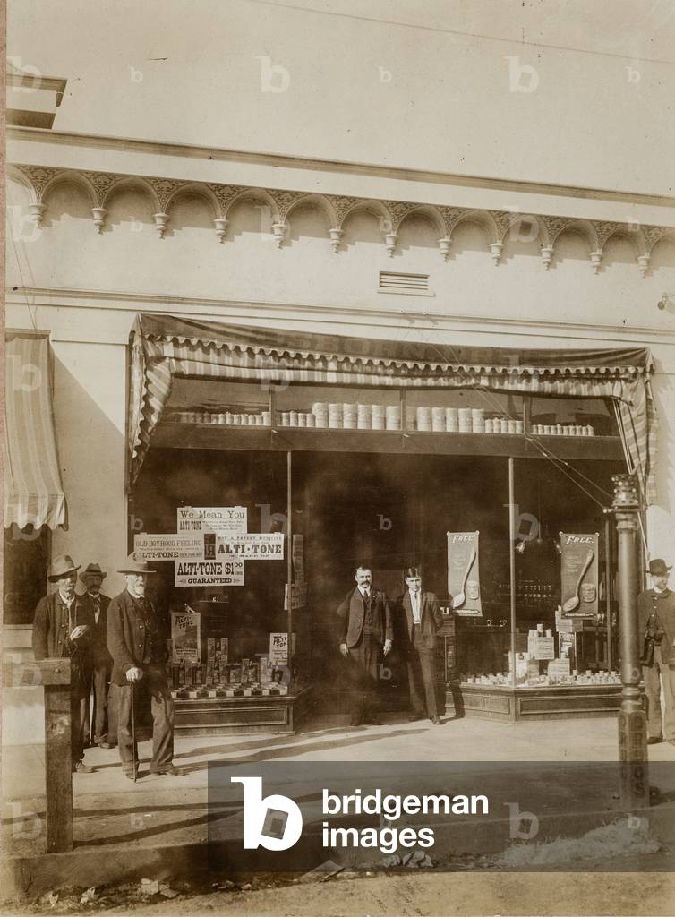 Six Men Pose in Front of Store Advertising Alto-Tone, c.1910 (silver gelatin print)
