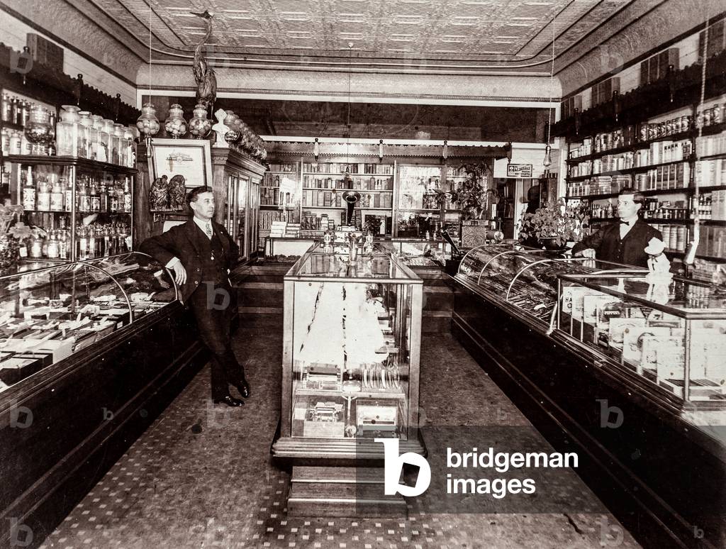 Two Men Pose in Pharmacy, c.1910 (silver gelatin print)