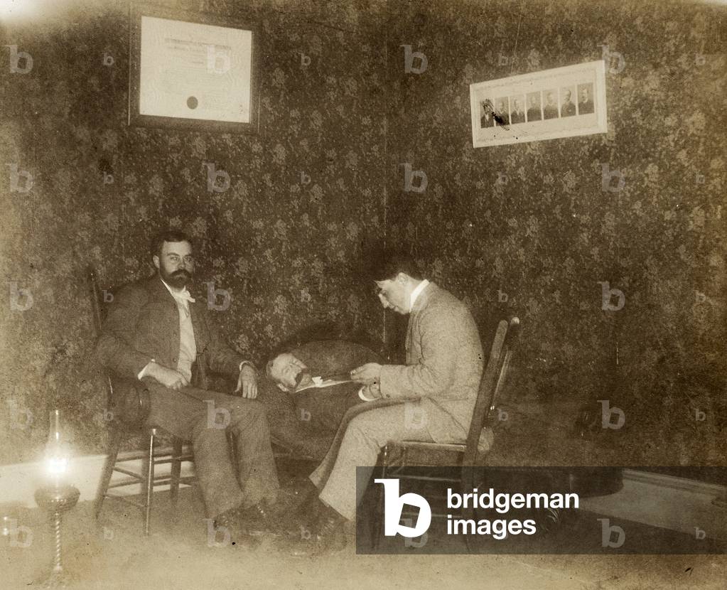 Physician Taking Pulse, 1897 (silver gelatin print)
