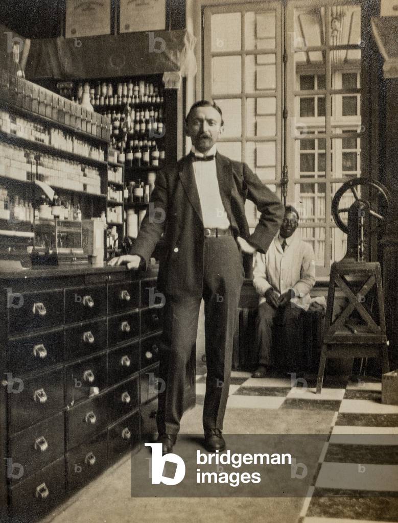 Pharmacist and Assistant in Pharmacy, c.1900 (silver gelatin print)