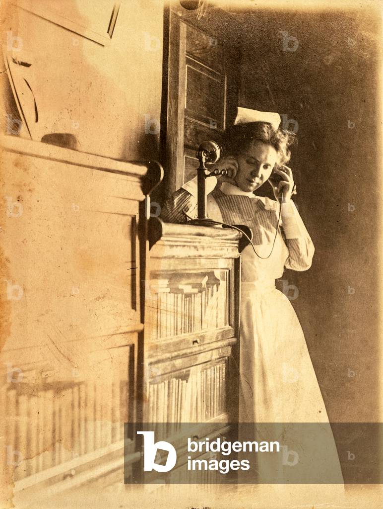 Nurse Using Telephone, c.1900 (silver gelatin print)
