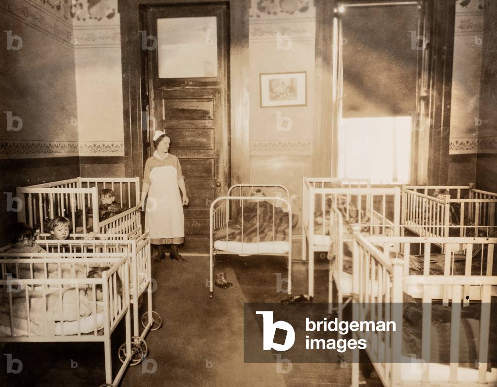 Nurse in Pediatric Ward with Cribs, c.1895 (silver gelatin print)