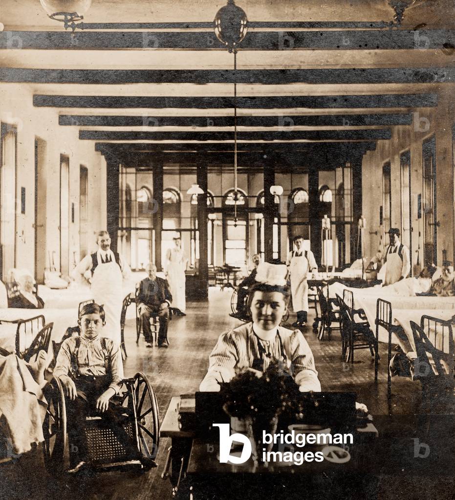 Nurse in Ward with Patients and Doctors, c.1895 (silver gelatin print)