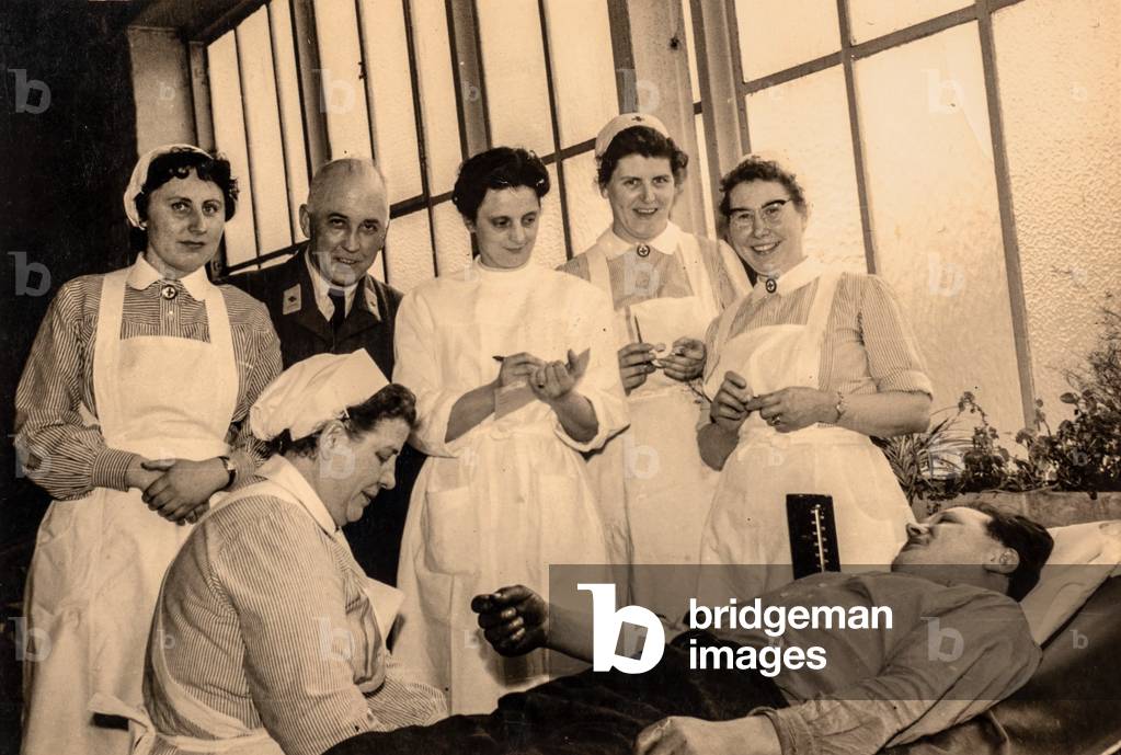 Nurses and Doctor with Patient, c.1945 (silver gelatin print)