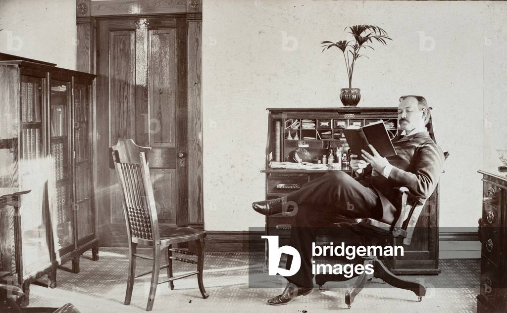 Doctor Reading Book in Office, c.1890 (silver gelatin print)