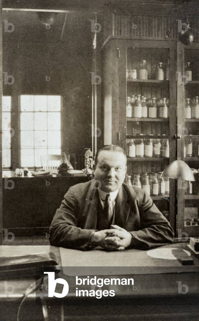 Doctor Sitting at Desk, c.1920 (silver gelatin print)