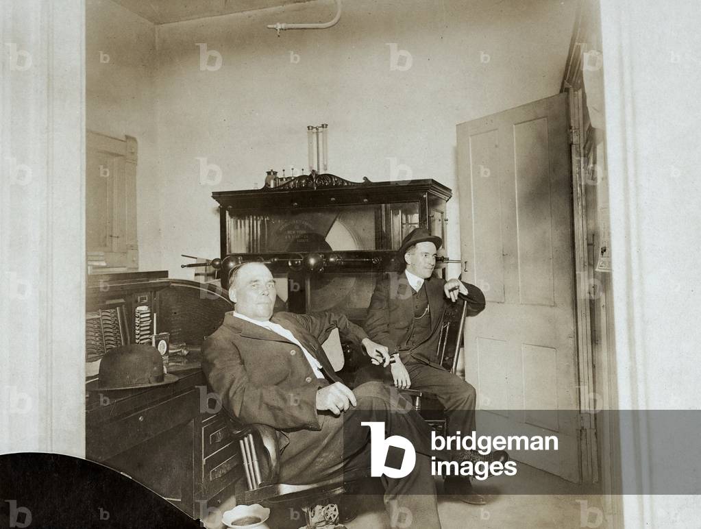 Two Men in Office with Electrotherapy Machine, c.1905 (silver gelatin print)