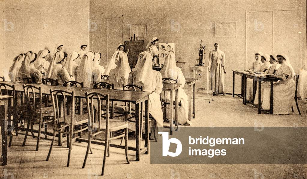 Nurses in a Hospital Classroom for La Société de Secours aux Blessés Militaires (now the Red Cross), France, c.1900 (postcard)